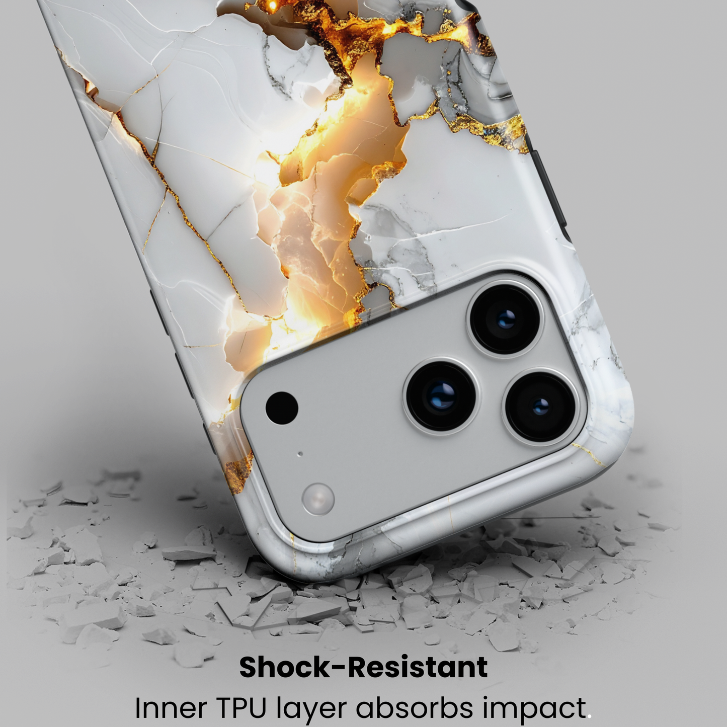 golden-fracture-handyhuelle-shock-resistant – Nahaufnahme der Hülle beim Aufpralltest mit Hinweis auf stoßabsorbierende TPU-Innenschicht.
