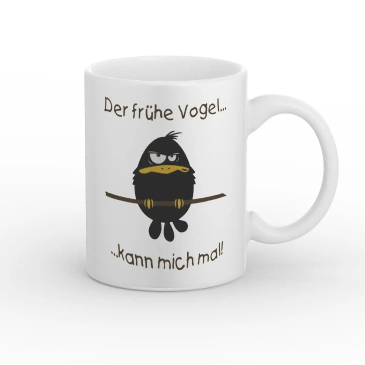 Lustige Tasse für Morgenmuffel mit einem schwarzen Vogel auf einem Ast und dem Spruch 'Der frühe Vogel... kann mich mal!